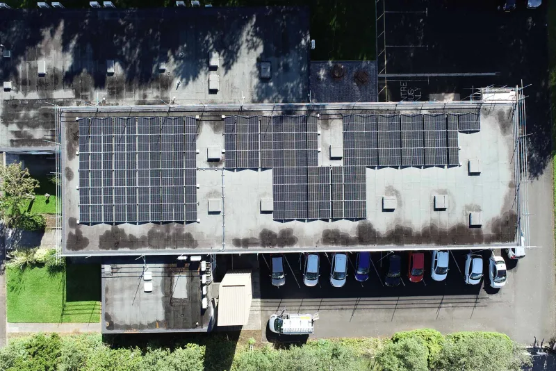 A large solar array on a flat industrial roof
