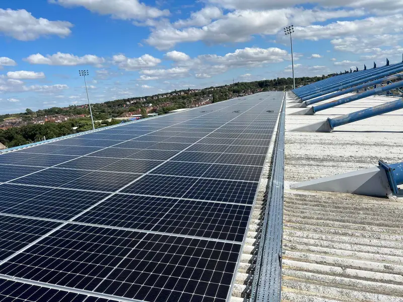 A large solar array on a flat industrial roof