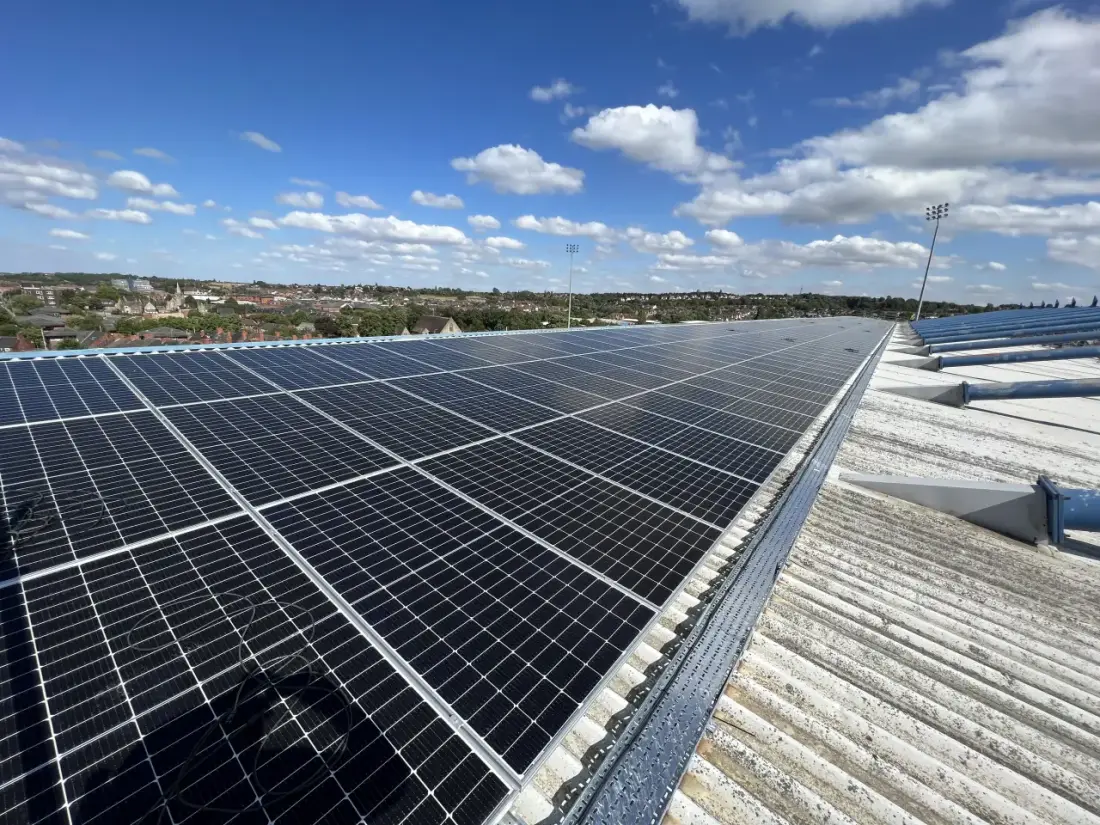 Rooftop solar panels on a football stadium stand